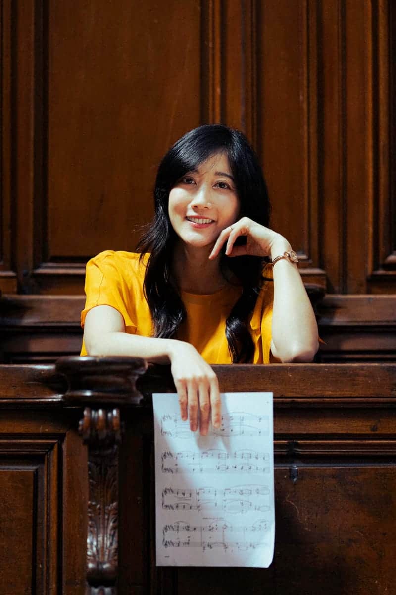 Sarah Kim, organist — portrait with musical score